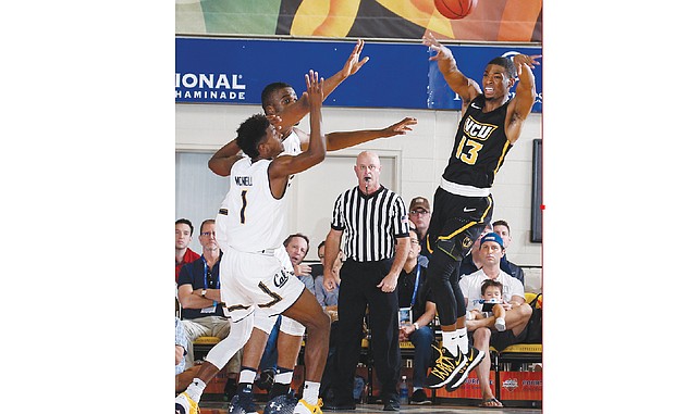 Virginia Commonwealth University guard Malik Crowfield hands off the ball during the Rams’ 83-69 victory on Nov. 21 over the University of California, Berkeley during the Maui Invitational.