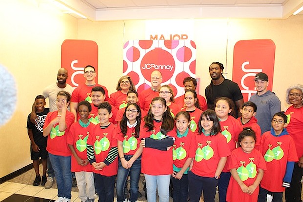 Houston Texans cornerback Johnathan Joseph and defensive end Jadeveon Clowney,  and  Houston Astros third baseman and World Series champion Alex Bregman with the 16 YMCA of Greater Houston excited kids who just got $100 for a JCPenney shopping spree/photo by Reginald Dominique