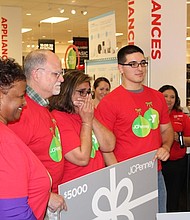 Surprised families receiving new LG washer and dryer/photo by Reginald Dominique