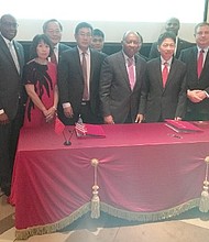 Photo includes Chinese and Houston business and government officials. From left to right: Marvalette Hunter, Chief of Staff, City of Houston; Council Member Larry Green; Mayor Sylvester Turner; Council Member Greg Travis; Greater Houston Partnership President and CEO, Bob Harvey; Mario Diaz, Director Houston Airport System; Andy Icken Director of Economic Development.
 