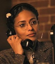 In a scene from TV One’s ‘Behind the Movement,’ Rosa (Golding) is finally allowed to make her one phone call to let her husband know she’s in jail (photo via TV One)