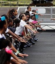 Joy Sewing teaching kids about ice skating. credit: youcaring.com/yearofjoyholidayiceskatingparty