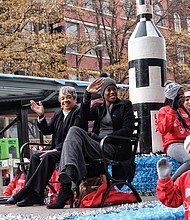 Welcoming Christmas on parade // Margot Lee Shetterly, author of the book “Hidden Figures” about NASA’s pioneering women, wave to the crowd. 
