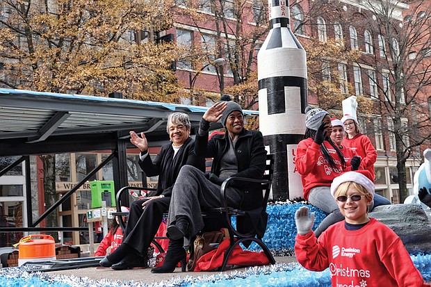 Welcoming Christmas on parade // Margot Lee Shetterly, author of the book “Hidden Figures” about NASA’s pioneering women, wave to the crowd. 
