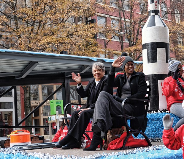 Welcoming Christmas on parade // Margot Lee Shetterly, author of the book “Hidden Figures” about NASA’s pioneering women, wave to the crowd. 
