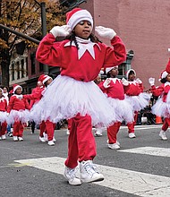 Holiday team spirit //
Youngsters in the Henrico Police Athletic League show their holiday spirit with choreographed moves as they make their way along Broad Street in the Dominion Energy Christmas Parade last Saturday in Downtown. Please see more photo on B3.