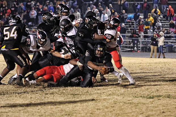 With 2:28 left on the clock, Highland Springs High School freshman Dre’Shawn Taylor stretches the ball across the goal line to give the Springers a 28-18 victory last Saturday over Nansemond River High School of Suffolk in the state 5A semifinals. The Springers will play Tuscarora High School of Leesburg on Saturday, Dec. 9, for the state title.