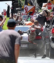 People fly into the air after being struck by a car that plowed into a crowd of counterprotesters at he Aug. 12 valley in Charlottesville. One person was killed and 19 others were injured. The driver, James A. Fields Jr., was charged with second degree murder.