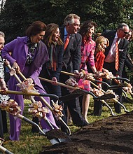 Gov. Terry McAuliffe, center, and his wife, First Lady Dorothy McAuliffe, to his right, are flanked by former Virginia first ladies Lynda Bird Johnson Robb (in purple) and Susan Allen (in pink) as they break ground Monday for the monument in Capitol Square that will honor women’s roles in Virginia’s history for more than 400 years. 