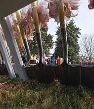 Ceremonial shovels wrapped with pink bows are lined up for the groundbreaking ceremony for “Voices from the Garden,” the new $3.7 million Virginia Women’s Monument in Capitol Square.