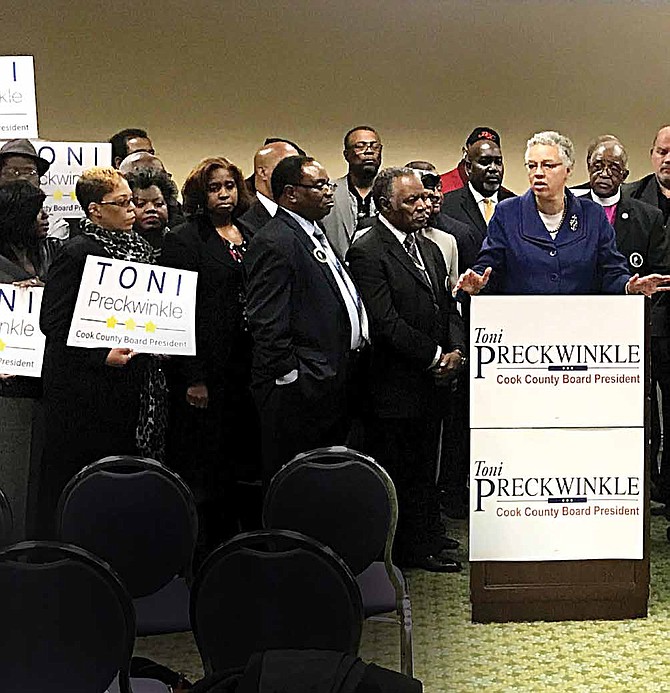 Clergy members from Cook County stood behind Toni Preckwinkle, Cook County Board President, as she spoke at the Lake Shore Cafe on Dec. 7. The religious community members were in attendance to show their
support for the Preckwinkle re-election campaign. Photo Credit: Katherine Newman