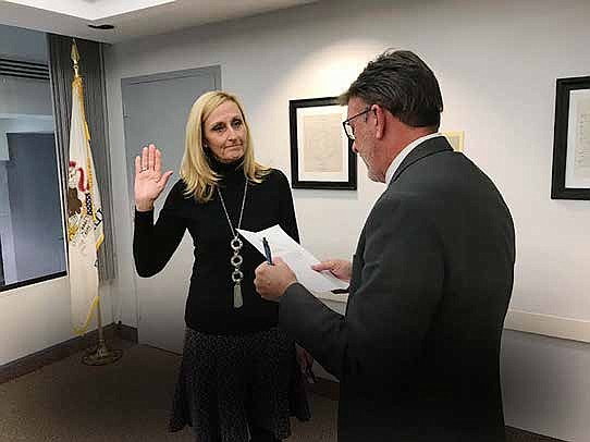 Vivian Payne, the newest member of South Suburban College Board of Trustees is sworn in by Vice President
of Administration Martin Lareau. Photo Credit: South Suburban College