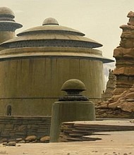 Jabba the Hutt's palace on Tatooine, as painted by Ralph McQuarrie. A combination of Byzantine shapes and clean Brutalist surfaces, it's an example of "Star Wars'" magpie approach to architecture
