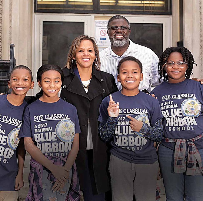 Congresswomen Robin Kelly is joined by students at the Poe Elementary School