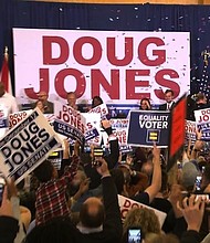 	Supporters of Doug Jones celebrate his victory in the Alabama special election at the Doug Jones election headquarters on December 12th, 2017./pool