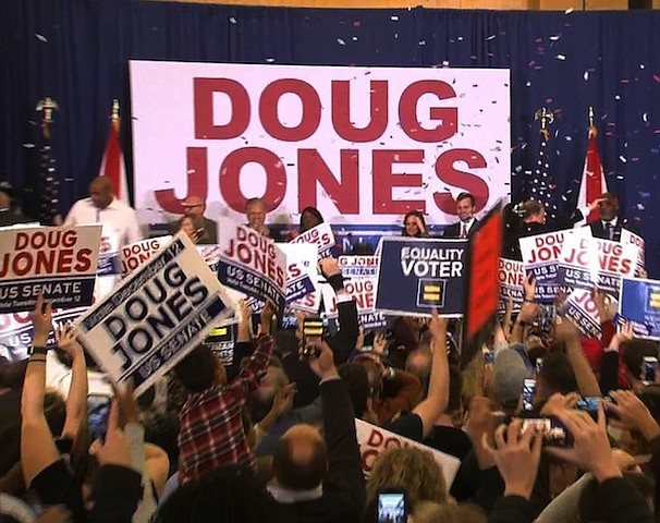 	Supporters of Doug Jones celebrate his victory in the Alabama special election at the Doug Jones election headquarters on December 12th, 2017./pool