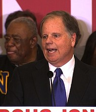 Doug Jones speaks at his election headquarters on December 12th, 2017. CNN projects that Alabama voters will elect Democrat Doug Jones to the US Senate, defeating Republican Roy Moore./pool