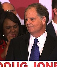 Doug Jones speaks at his election headquarters on December 12th, 2017. CNN projects that Alabama voters will elect Democrat Doug Jones to the US Senate, defeating Republican Roy Moore./pool