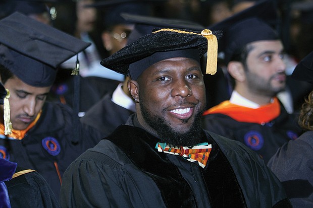 Charlottesville Vice Mayor Wes Bellamy receives his doctorate at Sunday’s ceremony, where VSU conferred degrees on 306 graduates.