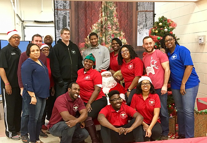 Volunteers pose with Santa for the 2017 Annual Thornton Township Christmas Care Program. 