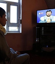 Houthi rebel commander Abdel-Malik al-Houthi is seen delivering a speech on the pro-Houthi Al-Maseera television after his rebels fired a missile at Saudi Arabia on Tuesday.