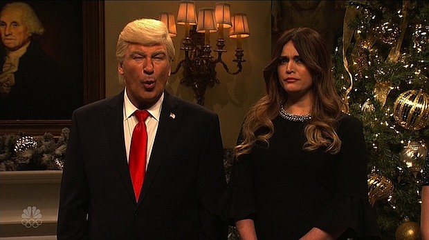 Alec Baldwin's President Trump stood alongside his wife, Cecily Strong's Melania Trump, as the two wished a Merry Christmas to all from the White House, with visits from Don Jr, Eric, Ivanka, and even Omarosa./NBC