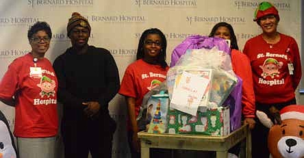 The staff at St. Bernard Hospital recently celebrated their 25th Annual Adopt-A-Family program by giving food, toys, clothing, gift cards and other items to 53 families including 15 seniors who live alone. Photo Credit: Christopher Shuttlesworth