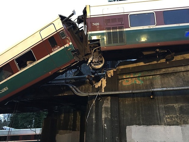 An Amtrak train car derailed and is dangling on to Interstate 5 in Pierce County, Washington, according to the Washington State Department of Transportation's twitter. All southbound lanes of the I-5 are closed due to the derailment.