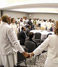 Sorority members celebrate Mrs. Ballard with a song during the formal ceremony. 