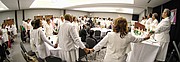 Sorority members celebrate Mrs. Ballard with a song during the formal ceremony. 