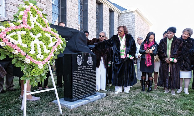 Members of Alpha Kappa Alpha Sorority unveil a marker last Saturday honoring the late Janet Jones Ballard, left, a Virginia Union University alumna and former administrator, by Coburn Hall on the Lombardy Street campus.