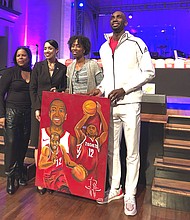 Mbah A Moute being presented with a gift from the Bread of Life Organization
from left to right:
Katherine Flowers
Council Woman Amanda Edwards
Artist Charis Kelly
Houston Rockets Forward Luc Mbah A Moute