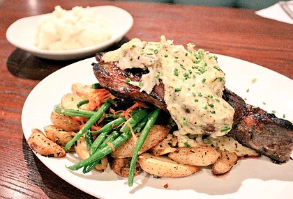 The Grand Marlin Restaurant's 14 ounce 1855 Angus rib eye served with herb roasted fingerling potatoes and seasonal vegetables 