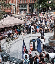 Cheers arise from the crowd as a statue honoring Richmond businesswoman and icon Maggie L. Walker is unveiled at a July 15 ceremony at the plaza at Broad and Adams streets.