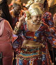 Celebrating Kwanzaa //  The festival included a procession of drummers and dancers led by Janine Bell, bottom left, founder and artistic director of the Elegba Folklore Society that produces the annual celebration. 
