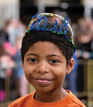 Greeting 2018 // Nathaniel Butler-Jackson rings in the new year at the daytime and quirky version of the midnight ball drop at the Science Museum of Virginia’s “Noon Year’s Eve” celebration for youngsters last Sunday. 