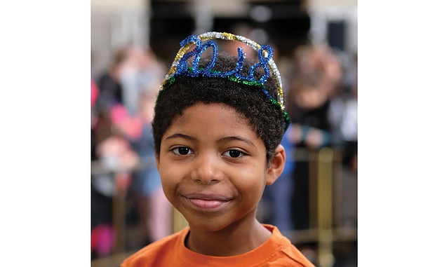 Greeting 2018 // Nathaniel Butler-Jackson rings in the new year at the daytime and quirky version of the midnight ball drop at the Science Museum of Virginia’s “Noon Year’s Eve” celebration for youngsters last Sunday. 