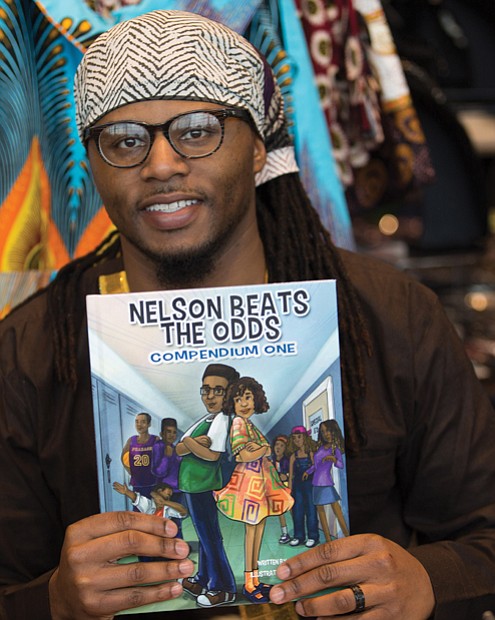 Author Ronnie Sidney, a licensed clinical social worker, displays one of his children’s books at the festival marketplace