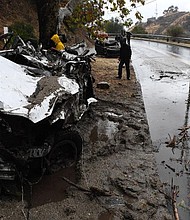 Mud fillls a street Tuesday in Burbank, California, destroying cars and damaging property.