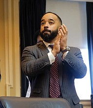 Richmond Delegate Jeff M. Bourne applauds the start of the session. 