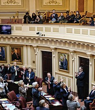 Virginia’s 40 senators start the new session with a standing ovation for Justin Fairfax, upper right, the soon-to-be lieutenant governor. He will be on the floor next week after he is inaugurated as the Senate’s presiding officer, replacing current Lt. Gov. Ralph Northam, who moves up to governor.