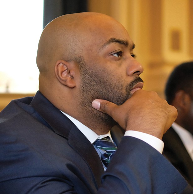 Delegate Lamont Bagby, new chair of the 20-member Virginia Legislative Black Caucus, thoughtfully watches his colleagues. 