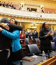 New delegates Dawn M. Adams of Richmond and Hala S. Ayala of Woodbridge share a happy embrace. They are among the 34 female legislators —  28 in the House and six in the Senate — a record for the General Assembly.
