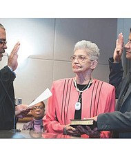 New sheriff in office //
Antionette V. Irving is Richmond’s new sheriff. She took office Jan. 1, but was sworn in early in preparing to replace former Sheriff C.T. Woody Jr. Judge C.N. Jenkins Jr., chief judge of the Richmond Circuit Court, administers the oath of office to Sheriff Irving on Dec. 8 as her mother, Shirley, holds the Bible. Location: John Marshall Courts Building in Downtown.