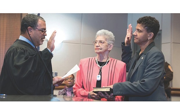 New sheriff in office //
Antionette V. Irving is Richmond’s new sheriff. She took office Jan. 1, but was sworn in early in preparing to replace former Sheriff C.T. Woody Jr. Judge C.N. Jenkins Jr., chief judge of the Richmond Circuit Court, administers the oath of office to Sheriff Irving on Dec. 8 as her mother, Shirley, holds the Bible. Location: John Marshall Courts Building in Downtown.