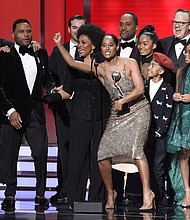 The cast and crew of “black-ish” accepts award for outstanding comedy series at the 49th annual NAACP Image Awards at the Pasadena Civic Auditorium, in Pasadena, Calif. Pictured from left are Laurence Fishburne, Anthony Anderson, Jeff Mecham, Jenifer Lewis, Tracee Ellis Ross, Kenya Barris, Yara Shahidi, Miles Brown, Peter Mackenzie, Marsai Martin, and Marcus Scribner (Credit: Photo by Chris Pizzello/Invision/AP/Shutterstock)