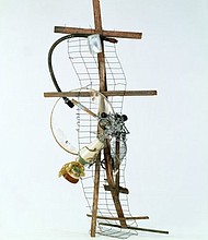 “No Light on the Crosses” (1994). Lonnie Holley, American, born 1950. Wood, metal fencing, headlight, ceramic lamp, electrical cords, ice cream scooper, metal drain cover, wire, drill bit, rope, and drum head. (© Lonnie Holley/Artists Rights Society [ARS], New York. Philadelphia Museum of Art, museum purchase, and gift of the Souls Grown Deep Foundation from the William S. Arnett Collection, 2017. (RON LEE/THE SILVER FACTORY.)