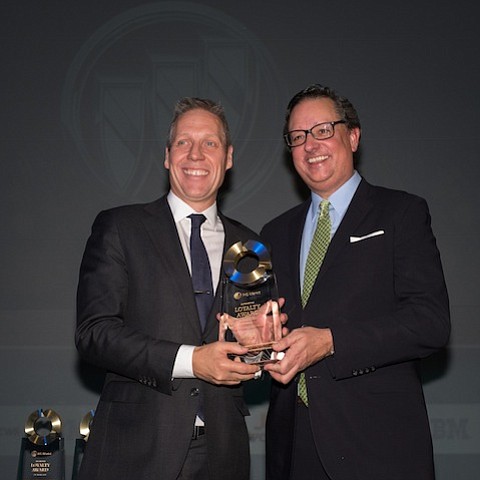 Buick and GMC Marketing Vice President Philip Brook (left) accepts the IHS Markit "Most Improved Loyalty to Make" award from IHS Markit Vice President Automotive Global Sales David Flynn Tuesday, January 16, 2018 in Detroit, Michigan. IHS Markit loyalty awards are presented annually to companies and brands that demonstrate the ability to retain owners over repeat buying cycles. Buick’s loyalty award comes after the brand delivered its best calendar year sales since 2004. (Photo by Steve Fecht for Buick)