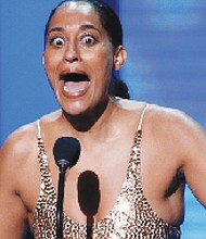 Tracee Ellis Ross, right, reacts to winning the award for Outstanding Actress in a Comedy Series for the popular television show, “black-ish.” 