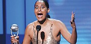 Tracee Ellis Ross, right, reacts to winning the award for Outstanding Actress in a Comedy Series for the popular television show, “black-ish.” 